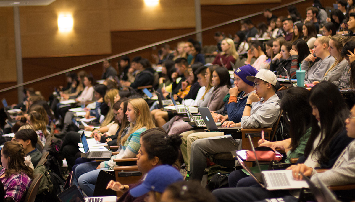 UW students listen to a lecture in a lecture hall.