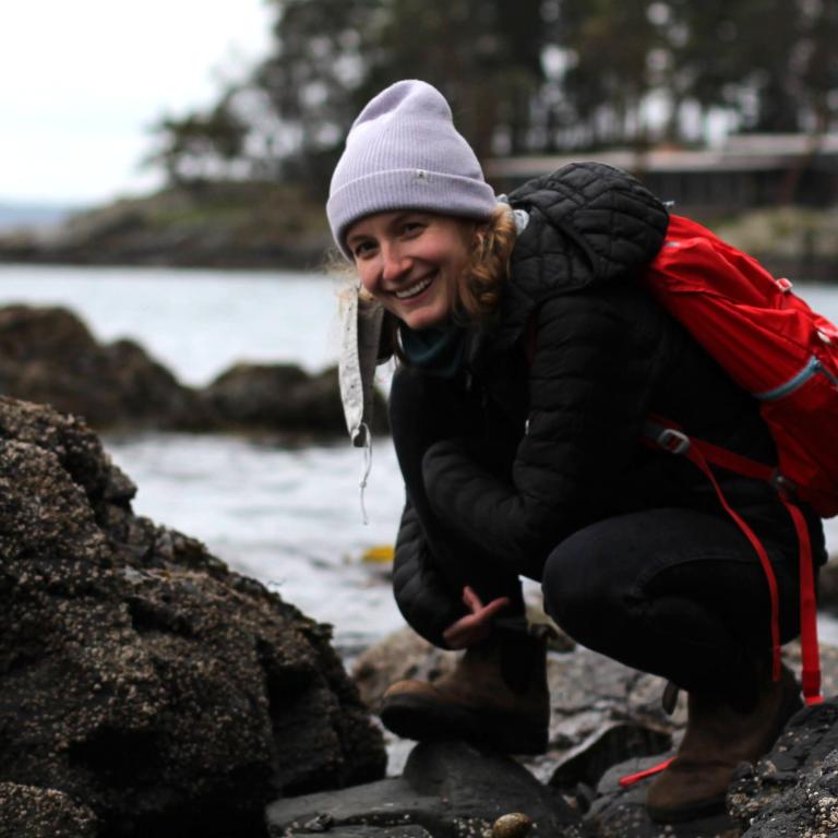 Meg smiling at the coast