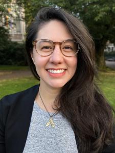 Marie Spiker, a young woman with large tortoiseshell glasses and long dark brown hair