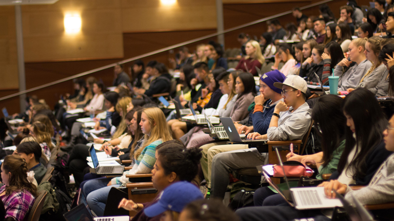 UW students listen to a lecture in a lecture hall.