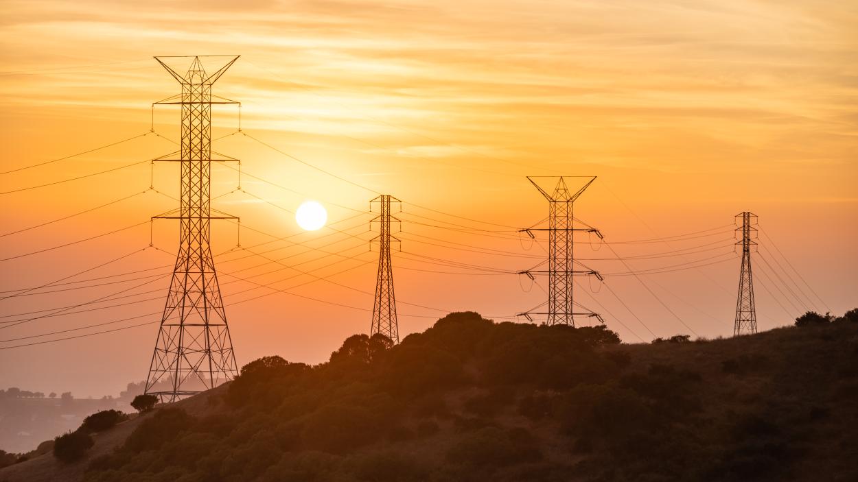 Photo of sunset with power lines.