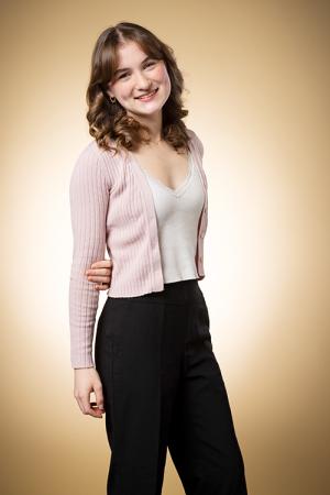 Angelina Durbin smiles standing up.